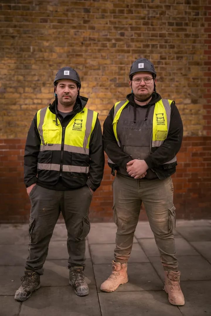 The Masonry Brothers founders at a brick wall