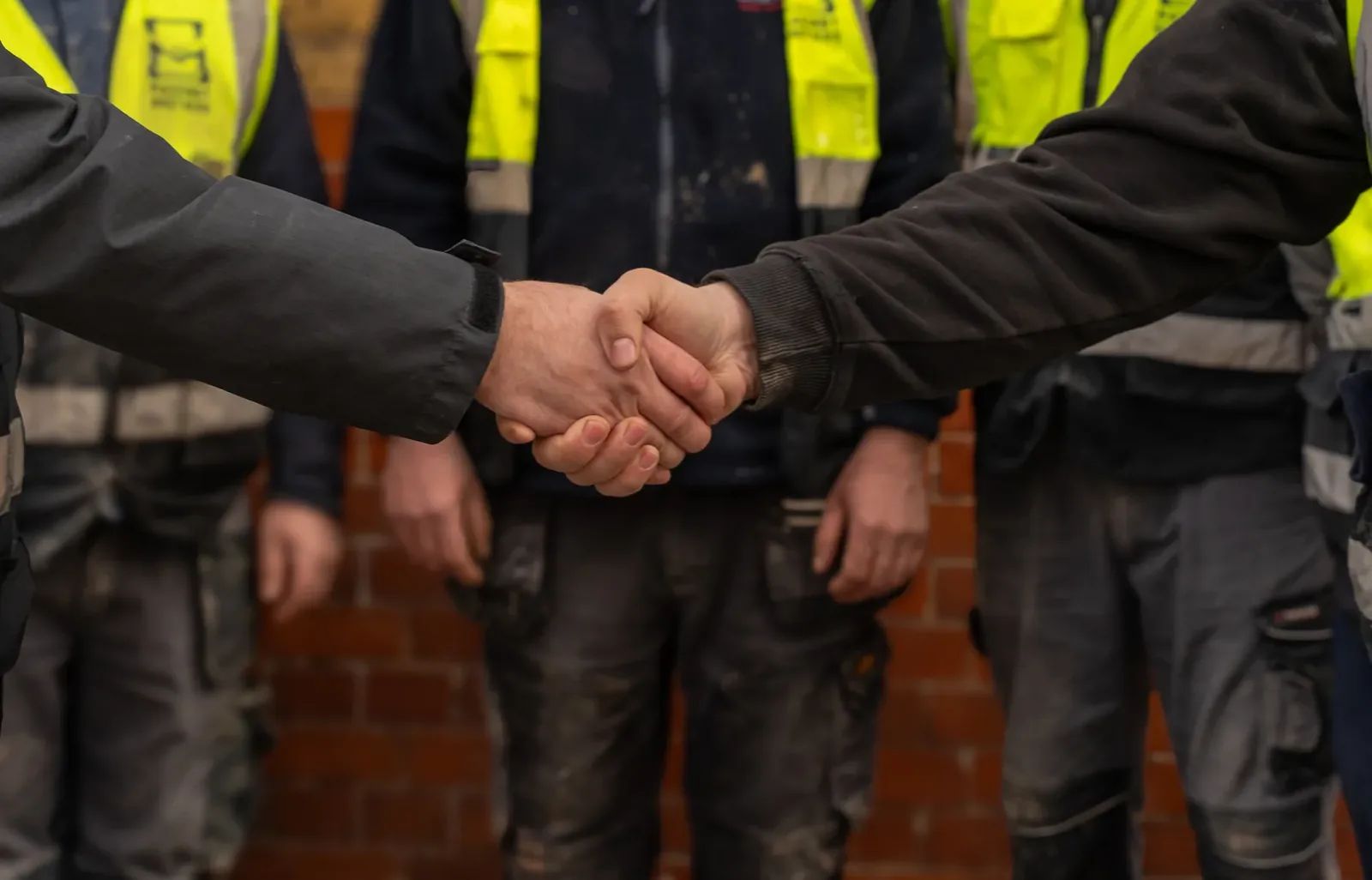 Masonry Brothers team handshake